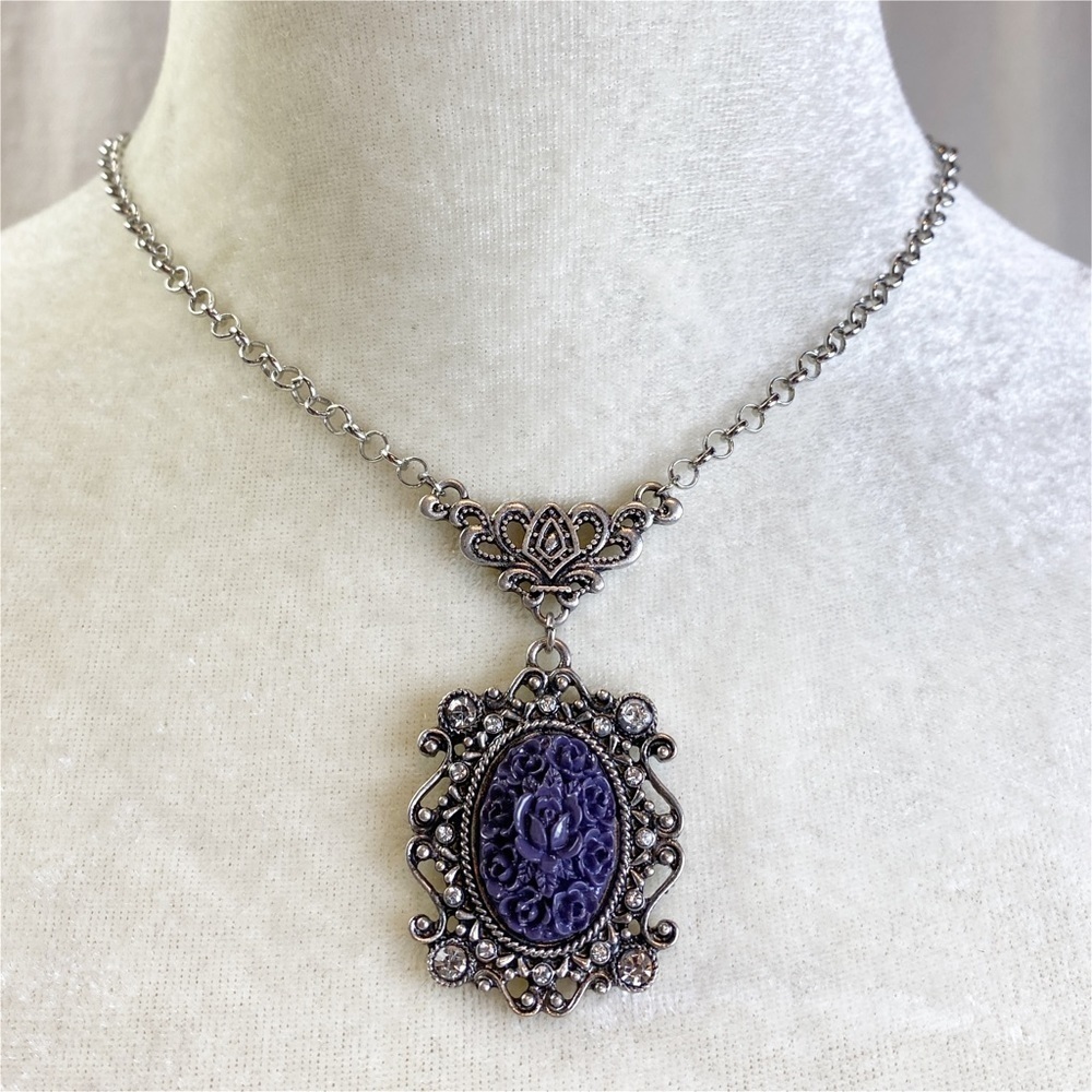 Antiqued silver tone necklace with purple carved acrylic flower pendant